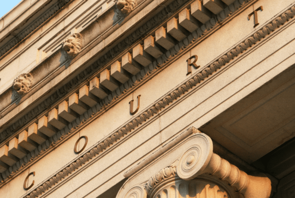 Part of a building with 'court' engraved above the entrance