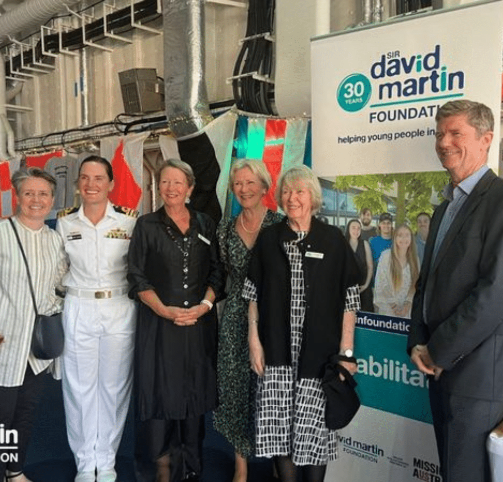 A Naval officer and the Martin Family together on the HMAS Supply II