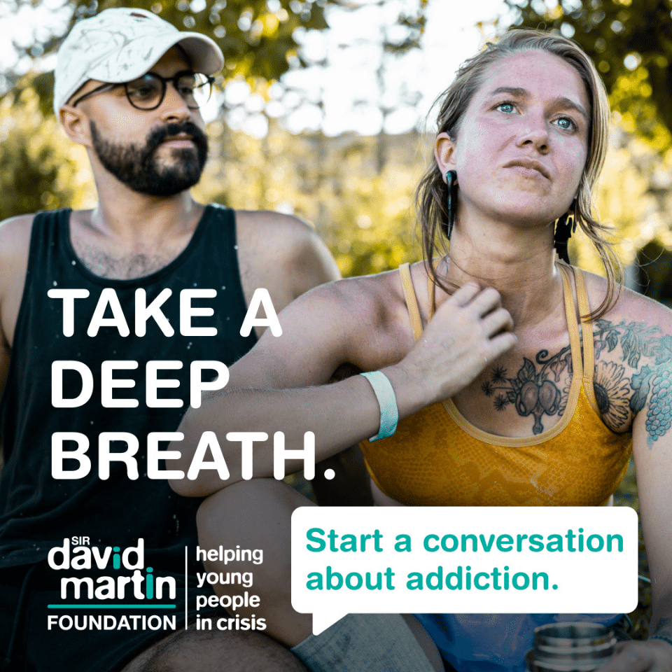 Image of two young people next to each other with the text 'Take a deep breath. Start a conversation about addiction.'
