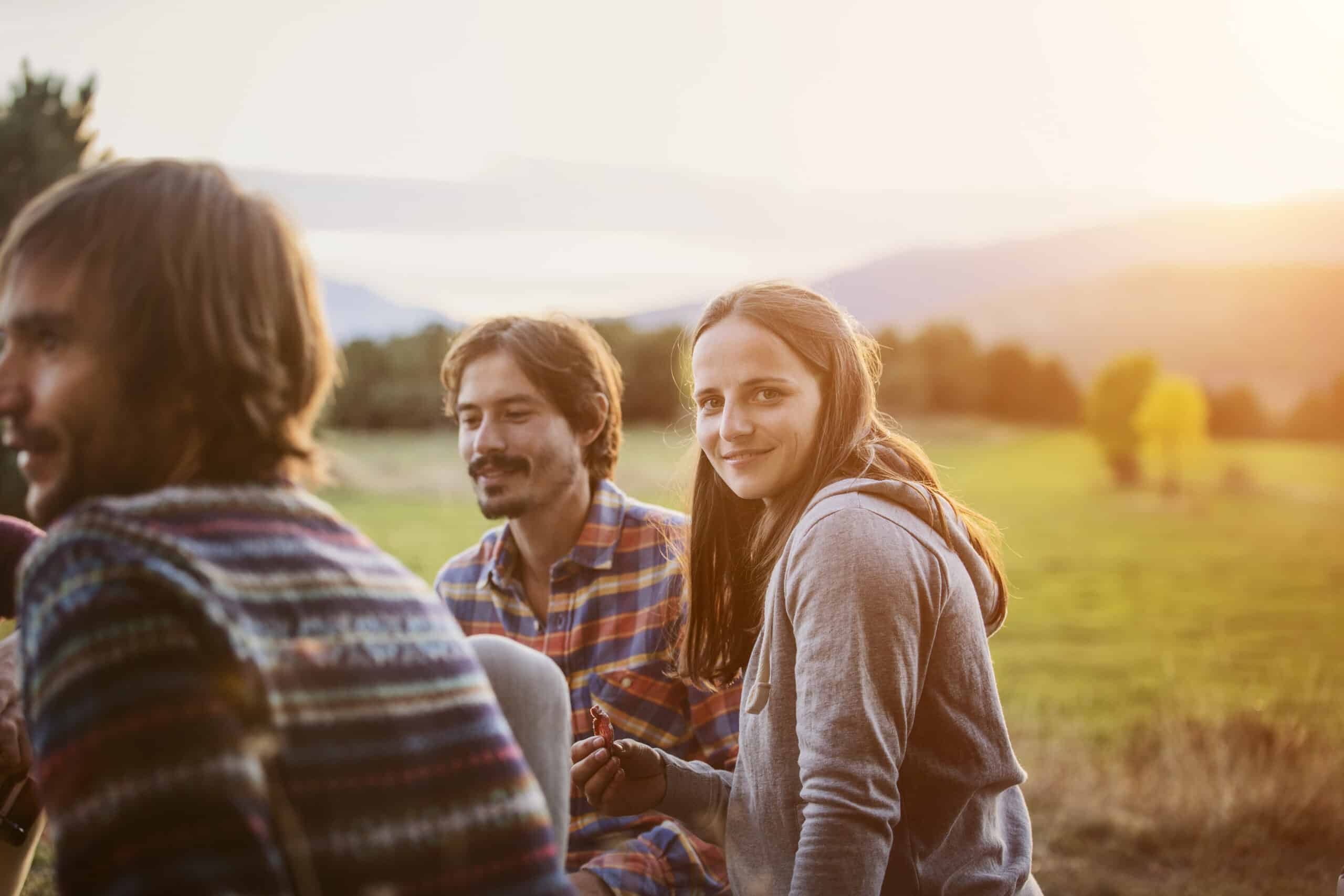 Young people sitting outside on a farm