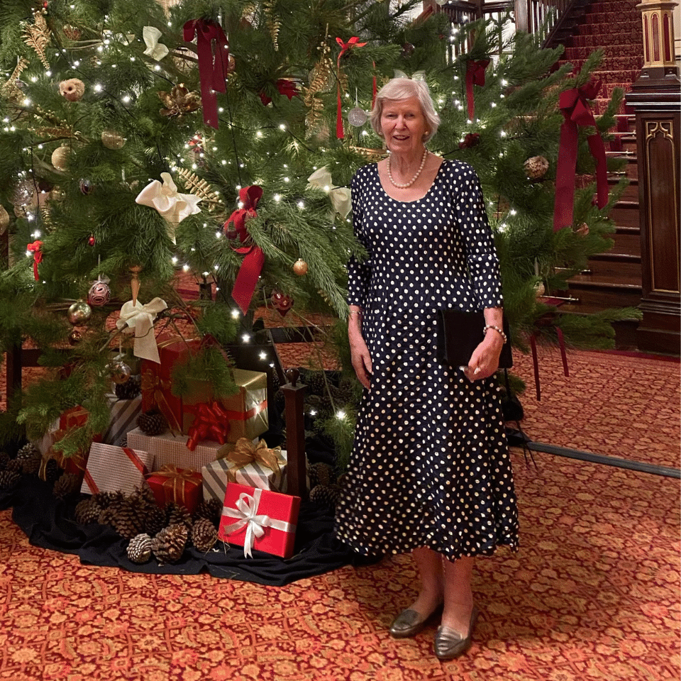 Lady Martin in front of the Christmas tree at Government House